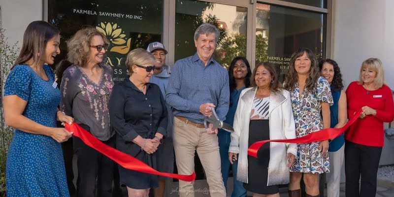Ribbon cutting ceremony with Dr. Parmela Sawhney and Coronado community members celebrating the grand opening of Amaya Wellness Spa